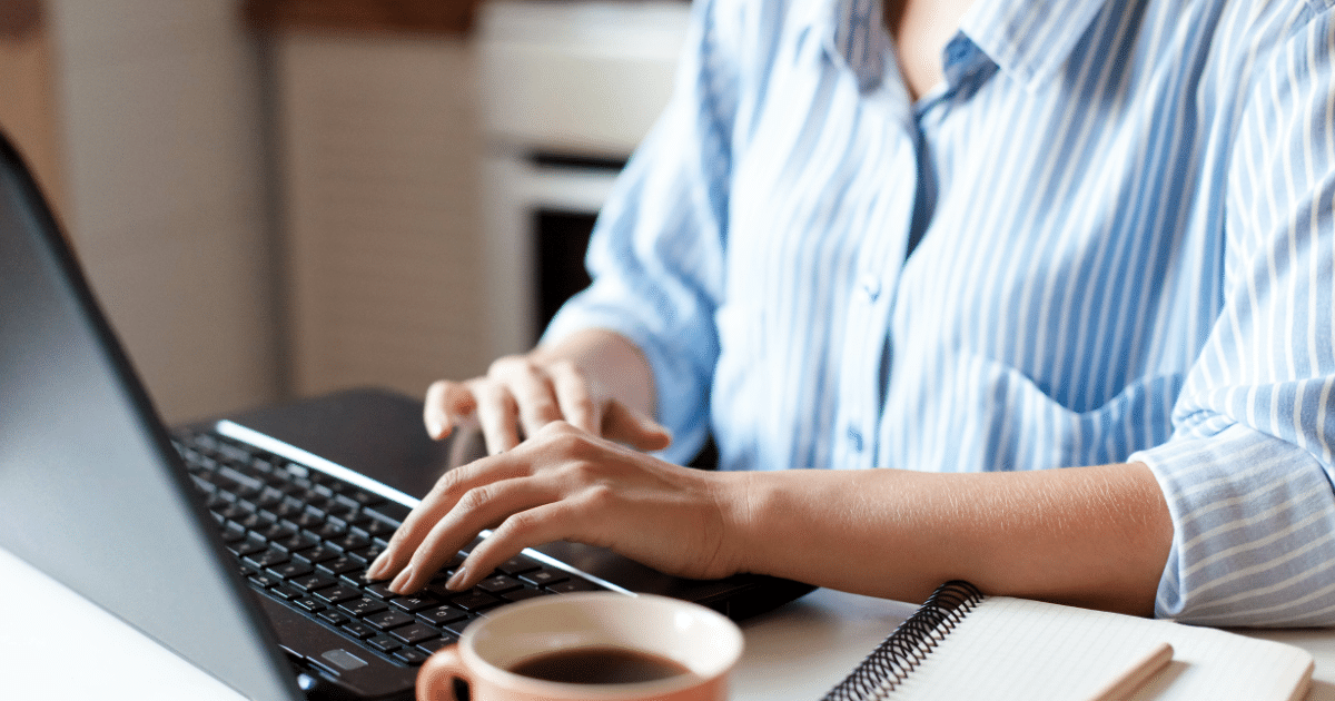 female scrolling on laptop, reviewing lead gen strategies