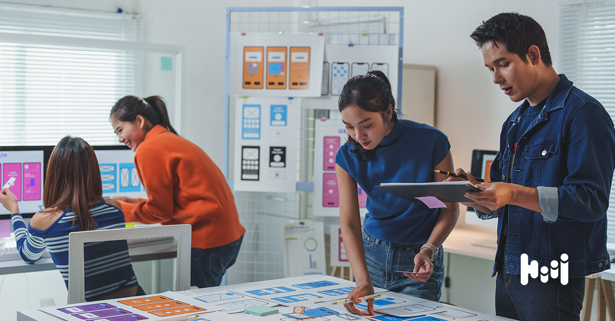 Marketing team members planning a multi-channel display advertising strategy.