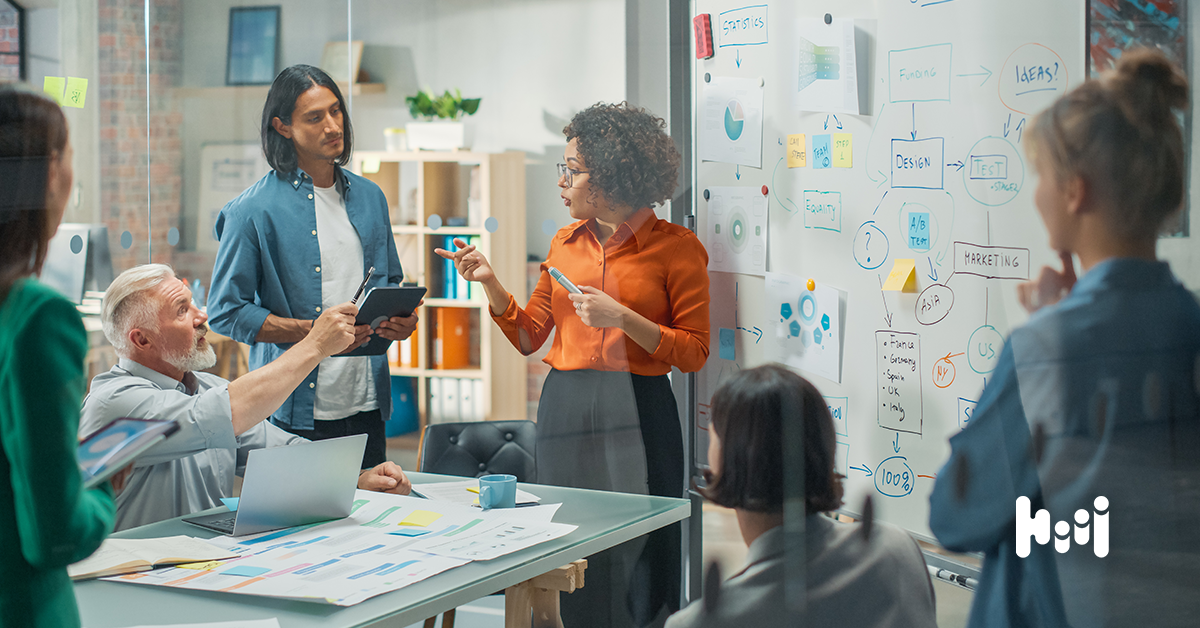 A marketing team discussing what makes a good display ad for their strategies.